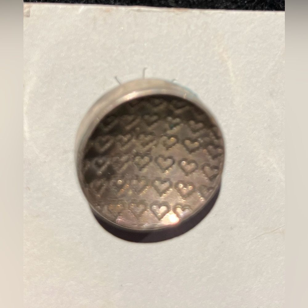 Never worn round silver earrings, approximately .75 inches tall - Picture 2 of 2